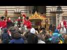 Queen Elizabeth II leaves Buckingham Palace by horse-drawn carriage