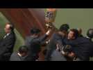 HK lawmakers dragged from chamber as leader heckled for second day
