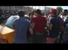 Injured Iraqi protesters are evacuated from scene of clashes scene in Baghdad