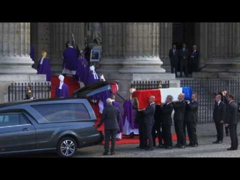 French ex-president Chirac's coffin arrives for church service