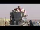 Residents of Syria border town Ras al-Ain flee Turkish offensive