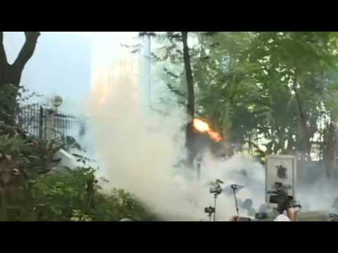 Hong Kong police and protesters exchange tear gas and petrol bombs