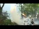 Hong Kong police and protesters exchange tear gas and petrol bombs