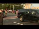 Trump waves to supporters in motorcade outside hospital