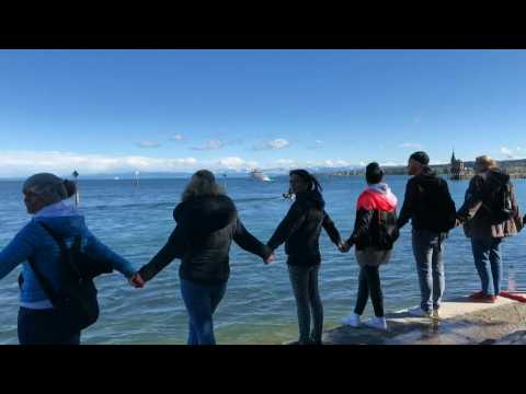 Anti-mask protesters form human chain in Konstanz, Germany