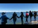 Anti-mask protesters form human chain in Konstanz, Germany
