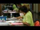 Mail-in ballots are being counted in battleground state of Wisconsin