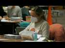 Election workers count mail-in ballots in battleground Wisconsin