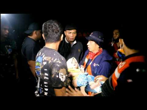 Rescuers scramble after flooding hits Indonesia's Sumatra island