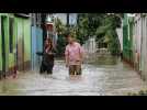 Homes and businesses submerged in flooding in northern Honduras