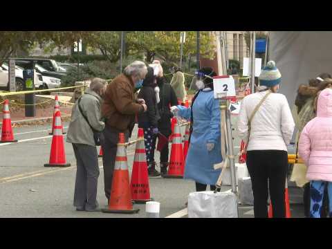 US: Washington DC residents line up at testing site as Covid-19 cases rise