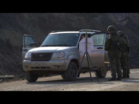 First civilians drive through Lachin corridor linking Armenia with Nagorno-Karabakh after peace deal