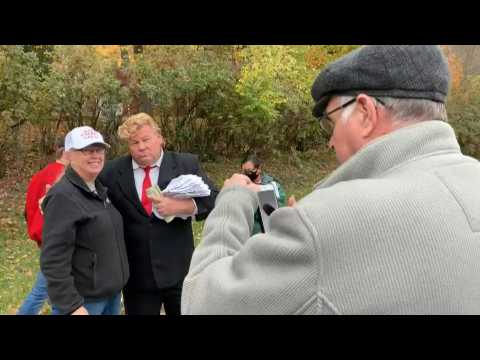 Trump supporters line up ahead of a rally in swing state Ohio