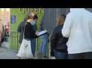 New Yorkers line up outside a Covid-19 test site in Queens