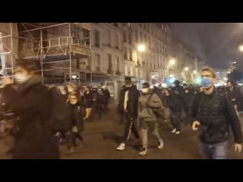 People protest in Paris against new coronavirus lockdown.