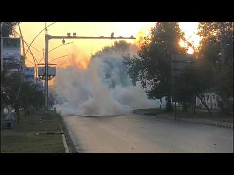 Pakistani security forces fire tear gas during anti-Macron protest