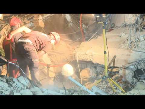 Rescue workers dig through rubble in Izmir following deadly quake