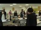 School pays tribute to murdered teacher as pupils return to class
