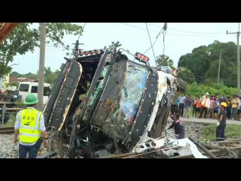 Images of Thailand site where 17 died in bus-train collision