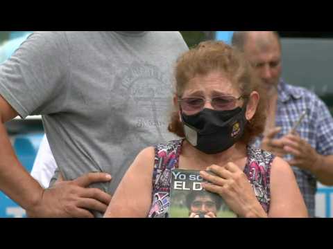 Fans gather outside Maradona's house after his death