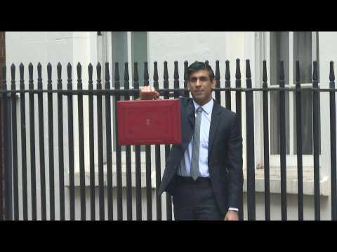 UK Finance Minister leaves 11 Downing St to deliver budget