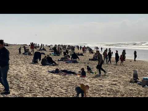 Gironde beach crowded on sunny day in France