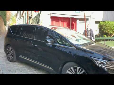 Sarkozy leaves home for court appearance on corruption charges