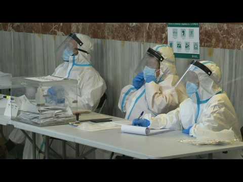 Catalans vote in polling station for voters quarantining or with Covid-19