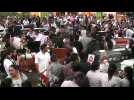 Colombians hold mass funeral for people killed in a landslide