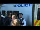 Police vans arrive to London court where Assange is expected