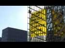Greenpeace banner hangs near EU Parliament in Brussels