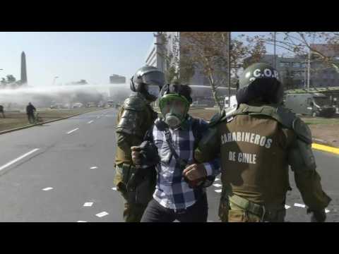 Chilean police disperse May Day protest with water cannons, arrests