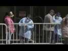 People wait outside newly opened COVID-19 testing center in Manhattan
