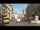 Coronavirus: images of people walking through Vienna as country lifts restricitions