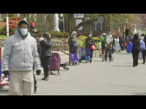 Residents in one of New York's hardest-hit areas line up for food