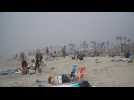 Californians flock to beach amid heat wave despite pandemic