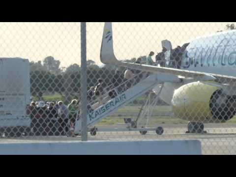 Coronavirus: passengers from the Grand Princess cruise ship board a plane