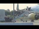 Coronavirus: passengers from the Grand Princess cruise ship board a plane