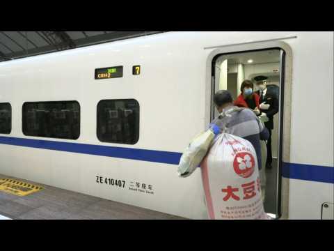 Coronavirus: Wuhan residents at train station as city exit ban lifted