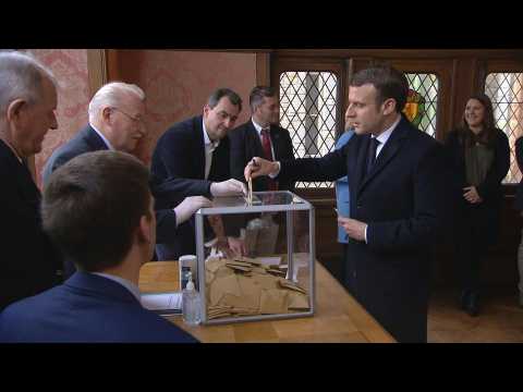 Emmanuel and Brigitte Macron vote in French local elections