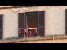 Italians sing from their windows amid nationwide lockdown
