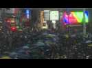 Crowds march at Hong Kong's popular shopping district