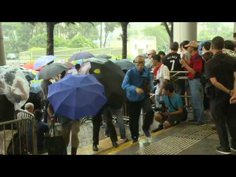 Court: People gather to support HK protesters charged with rioting