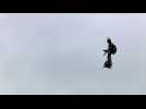 A "flying man" over the Champs-Elysees at Paris parade