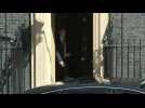 Theresa May leaves Downing Street for parliament on her last day in office