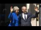 Outgoing Theresa May waves goodbye as she leaves Downing Street