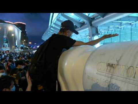 Tensions high while police and HK protesters separated by barriers