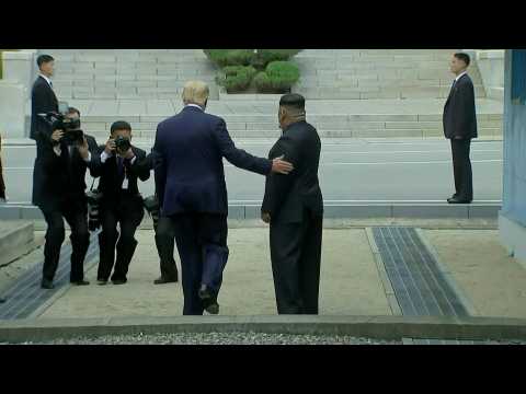 Trump shakes hands with Kim and steps into North Korea
