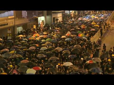 HK protesters stay on streets after China office egged at rally end