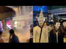 Tear gas as Hong Kong protesters don Halloween masks
